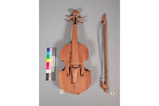 Photos of a violin and horsehair bow with broken hair side by side