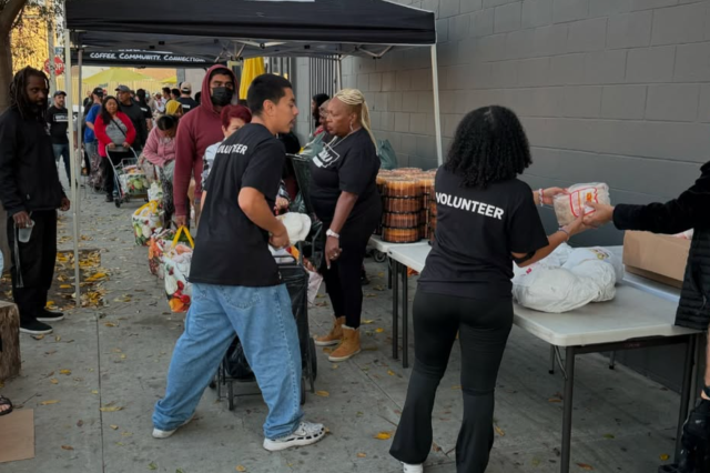 Volunteers handing out free food to neighbors in need.