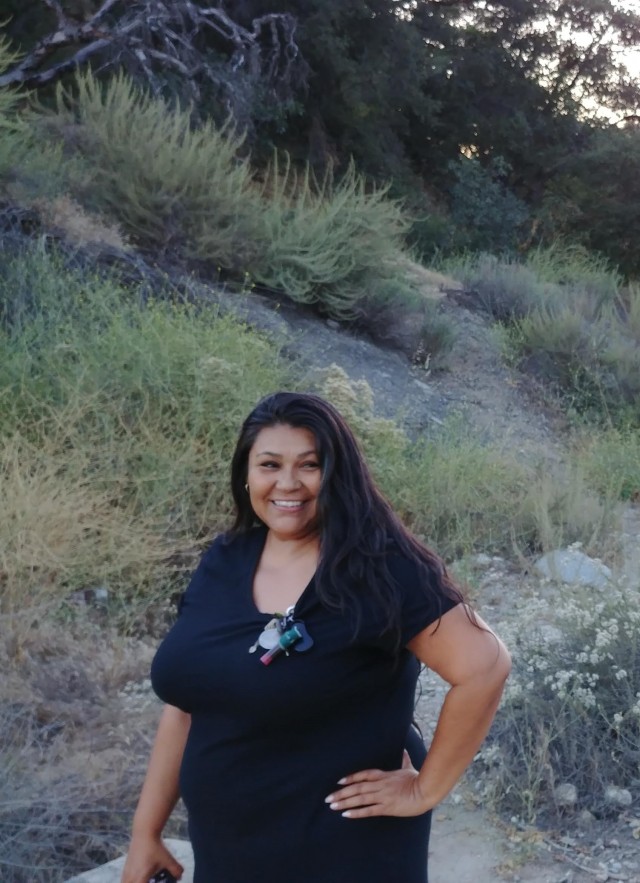 Brenda Kyle stands in the dry creek bed at Eaton Canyon