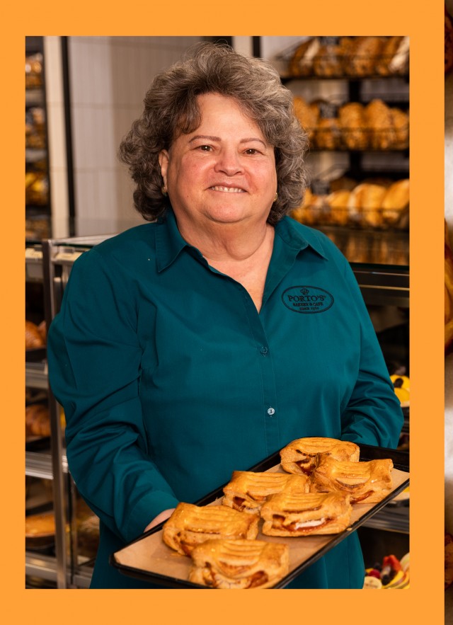 Woman holding bread and bread on right 