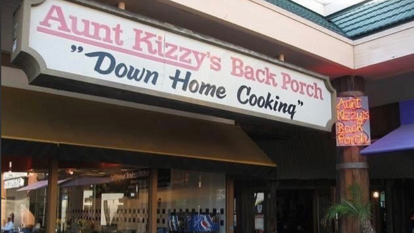Restaurant sign reading "Aunt Kizzy’s Back Porch Down Home Cooking"