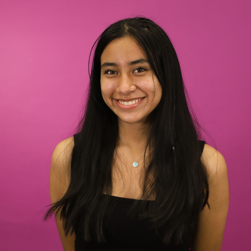 Person wearing back shirt on purple background